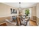 Dining room featuring a modern glass table, chandelier, and stylish decor at 6839 S Niagara Ct, Centennial, CO 80112