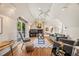 Bright living room with a fireplace, vaulted ceiling, and balcony access at 6839 S Niagara Ct, Centennial, CO 80112