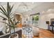 Airy living room with vaulted ceiling, balcony access and stylish furniture at 6839 S Niagara Ct, Centennial, CO 80112