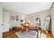 Bright home office with hardwood floors, natural light, and stylish decor at 6839 S Niagara Ct, Centennial, CO 80112