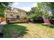 Backyard showing a nice deck with stairs down to the lawn at 6318 Newton Ct, Arvada, CO 80003
