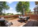 A wooden deck with outdoor furniture offers a great place for entertaining at 6318 Newton Ct, Arvada, CO 80003