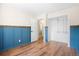 Bedroom featuring chair rail molding, closet and a view to the bathroom at 6318 Newton Ct, Arvada, CO 80003