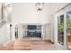 Bright living room with fireplace and access to deck through sliding glass doors, perfect for indoor-outdoor living at 6318 Newton Ct, Arvada, CO 80003