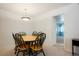 Bright dining room featuring a round table with seating for six and a modern light fixture at 13093 W Cedar Dr # 322, Lakewood, CO 80228