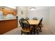 Dining area featuring a wooden table with chairs and is open to the kitchen at 13093 W Cedar Dr # 322, Lakewood, CO 80228