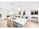 Modern kitchen island with white countertop and stainless steel appliances at 1417 Zenobia St, Denver, CO 80204