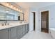 Bathroom boasts double vanity and a view to the custom closet at 13322 Marion St, Thornton, CO 80241