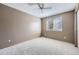 Neutral bedroom with a ceiling fan and natural light from a window at 13322 Marion St, Thornton, CO 80241