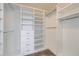 Custom walk-in closet with built-in shelving and drawers for optimal storage at 13322 Marion St, Thornton, CO 80241