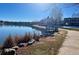 Scenic waterfront view featuring a small pier, walking path, and peaceful water, adding charm and recreational opportunity at 13322 Marion St, Thornton, CO 80241