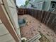 A backyard featuring gravel and an egress window well, creating a functional and secure outdoor space at 2239 S Truckee St, Aurora, CO 80013