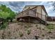 A backyard with a wooden deck and rock features provides an inviting outdoor space at 2239 S Truckee St, Aurora, CO 80013