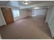 A spacious basement featuring neutral carpet, offering a versatile area for a variety of uses at 2239 S Truckee St, Aurora, CO 80013