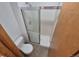 This bathroom features a toilet and glass enclosed shower at 2239 S Truckee St, Aurora, CO 80013