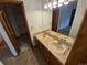 Bathroom features a double sink vanity and updated lighting fixture at 2239 S Truckee St, Aurora, CO 80013
