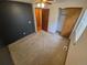An open bedroom with a closet, neutral carpet, and modern ceiling fan fixture for additional comfort at 2239 S Truckee St, Aurora, CO 80013