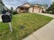 Charming home featuring well-maintained lawn, inviting front porch, and appealing exterior paint scheme at 2239 S Truckee St, Aurora, CO 80013