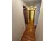 Hallway with wood floors leads to other rooms in the house at 2239 S Truckee St, Aurora, CO 80013