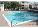 Community pool with lounge chairs and clear water, perfect for relaxing at 4896 S Dudley St # 8, Littleton, CO 80123