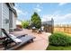 Outdoor patio features lounge chairs, fire pit, outdoor dining table, and mature landscaping at 10730 Hillrose St, Parker, CO 80134