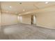 A finished basement offers ample space with plush carpeting and recessed lighting at 10730 Hillrose St, Parker, CO 80134