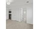 Bedroom with plush carpet, white walls, an open door and en suite bathroom at 10730 Hillrose St, Parker, CO 80134