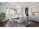 Elegant dining room featuring modern chandelier, bay window, and stylish décor at 10730 Hillrose St, Parker, CO 80134