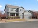 Charming two-story home featuring a covered porch, well-manicured lawn, and a three-car garage at 10730 Hillrose St, Parker, CO 80134