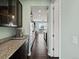 Modern kitchen with dark wood cabinetry, granite countertops, and stainless steel appliances at 10730 Hillrose St, Parker, CO 80134