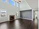 Bright and airy living room featuring a fireplace and large windows for natural light at 10730 Hillrose St, Parker, CO 80134