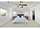 Serene bedroom with tray ceiling, ceiling fan, neutral colors, and natural light at 10730 Hillrose St, Parker, CO 80134