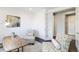 Inviting office space with decorative chairs, accent rugs, and a desk at 10730 Hillrose St, Parker, CO 80134
