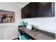 Home office space featuring a desk with dark cabinets, and a globe at 10730 Hillrose St, Parker, CO 80134