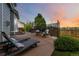 Outdoor patio with string lights, lounge chairs, fire pit, and decorative privacy screen at 10730 Hillrose St, Parker, CO 80134