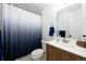 Bathroom featuring modern vanity, a shower with curtain and decorative towels at 4485 E Andover Ave, Castle Rock, CO 80104