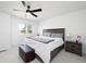 Bright bedroom featuring a large bed, ceiling fan, and natural light from the window at 4485 E Andover Ave, Castle Rock, CO 80104