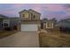 Charming two-story home featuring a two-car garage and inviting curb appeal with manicured landscaping at 4485 E Andover Ave, Castle Rock, CO 80104