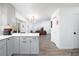 Bright open-concept, with modern gray cabinets connecting the living room, kitchen, and dining areas at 4485 E Andover Ave, Castle Rock, CO 80104