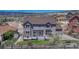 A well-maintained home featuring a spacious deck, complemented by a lush green yard and fencing at 16184 Gold Creek Dr, Monument, CO 80132