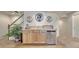 Basement wet bar with wooden cabinets and mini-fridge at 16184 Gold Creek Dr, Monument, CO 80132