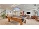 Basement with a pool table, TV area and wet bar at 16184 Gold Creek Dr, Monument, CO 80132