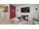Cozy basement space with large TV, glass table, and unique decor at 16184 Gold Creek Dr, Monument, CO 80132