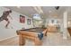 Basement with pool table, sports decor and stairs at 16184 Gold Creek Dr, Monument, CO 80132