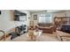 Cozy basement with comfortable seating, TV, and a glass coffee table at 16184 Gold Creek Dr, Monument, CO 80132
