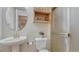 Bright bathroom featuring a white pedestal sink and shower with glass door at 16184 Gold Creek Dr, Monument, CO 80132