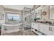 Beautiful bathroom with a standalone tub, natural light, and a glass-enclosed shower at 16184 Gold Creek Dr, Monument, CO 80132