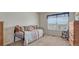 Cozy bedroom featuring comfortable daybed, ample natural light, and traditional furnishings at 16184 Gold Creek Dr, Monument, CO 80132