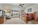 Bedroom featuring large window, a platform bed, chair, and carpeted floors at 16184 Gold Creek Dr, Monument, CO 80132