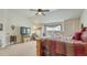 Bedroom featuring large window, a platform bed, chair, and carpeted floors at 16184 Gold Creek Dr, Monument, CO 80132
